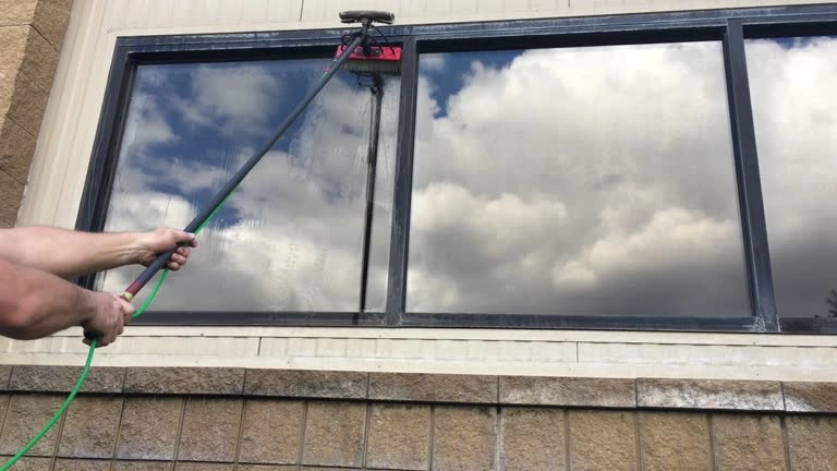 Rock Home Solutions reach and wash window cleaning system in operation in Gibraltar using carbon-fibre telescopic pole and pure water technology