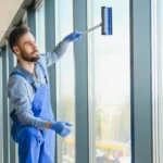 Professional safety standards in commercial window cleaning being implemented by Rock Home Solutions at a Gibraltar high-rise office building.