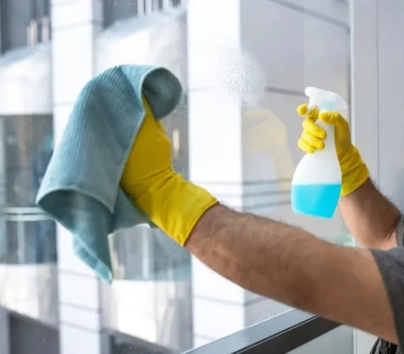 Expert residential window cleaners safely washing the upper-floor windows, skylights, and glass balconies of a luxury Mediterranean villa in the South District of Gibraltar.